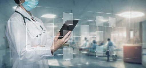 Doctor working on virtual screen with medical process .