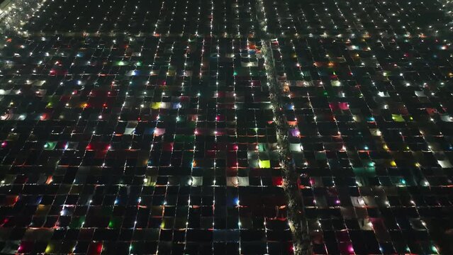 Aerial view of local market colourful tents at Minar Moshjid Tabling for the Global Muslims Congregation at night in Tongi, Dhaka, Bangladesh.