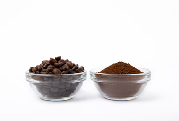 Bowl of ground coffee and beans isolated on a white background.