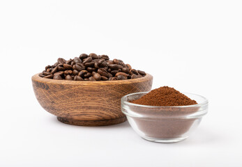 Bowl of ground coffee and beans isolated on a white background.