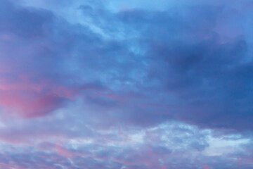 Deep blue sky with pink clouds