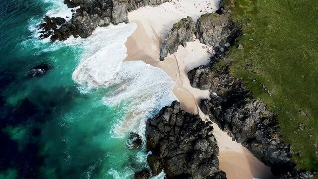 Aerial view of wild rocky cliffs along the coastline in Iceland southern region.