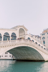 
The Rialto Bridge is a magical place and regularly attracts people from all over the world. Summer is in the air and the white stone reflects in the blue water.