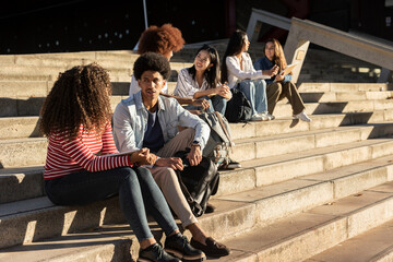 Fototapeta group of happy teen high school students outdoors obraz
