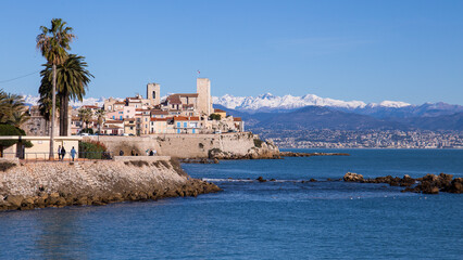 Old town of Antibes, French Riviera, France with snow covered alps in the background