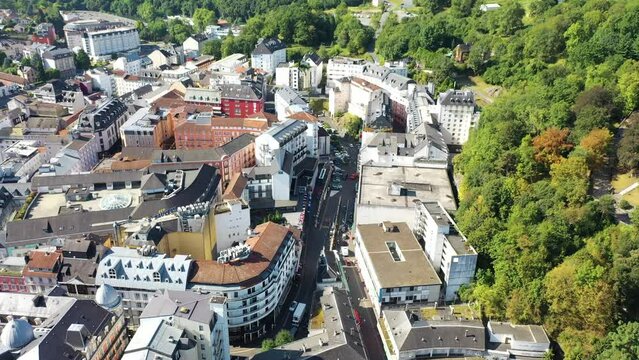 Aerial view of Lourdes downtown in the foothills of the Pyrenees mountains, France.