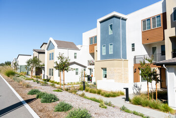 New modern terraced houses in a housing development in California on a clear fall day