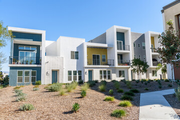 Newly built row houses in a housing development in California on a clear autumn day