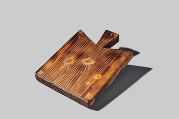 Wooden cutting board on neutral background