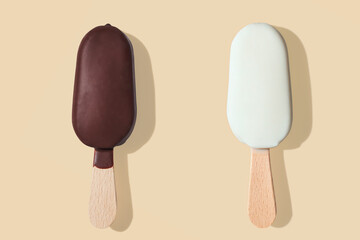 Chocolate and vanilla ice cream on a stick on yellow pastel background