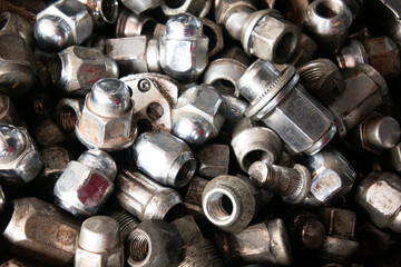 surface full of used wheel  lug nuts