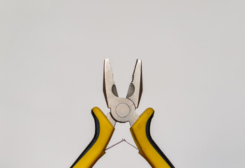 Wire cutter pliers closeup on white background isolated