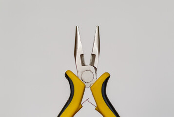 Round pliers for cutting wire close-up on white background isolated