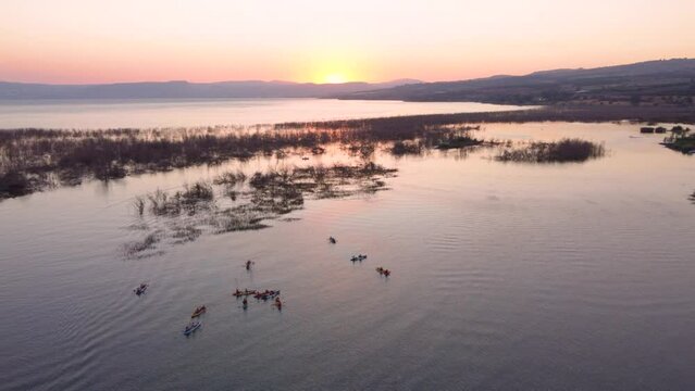 Sea of Galilee, Israel - 4 November 2022: Aerial view of people kayaking in a lake.