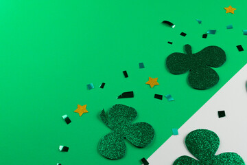Image of green clover and copy space on white and green background