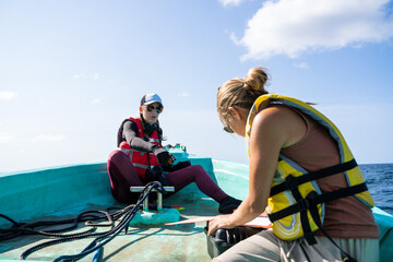 Two marine biologist working on a boat on the sea