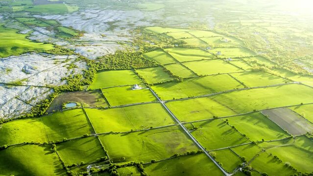 Aerial view of Cong Village surrounded by agricultural fields along Lough Corrib lake, Ireland.