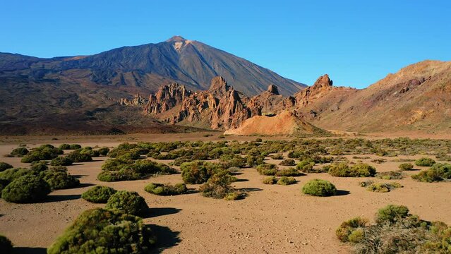 Volcano El Teide in Tenerife Spain with the green plants on the mountain side. Aerial view.