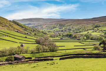 A view down the valley overlooking Thwaite in Swaledale in the Yorkshire Dales, with Kisdon Fell...