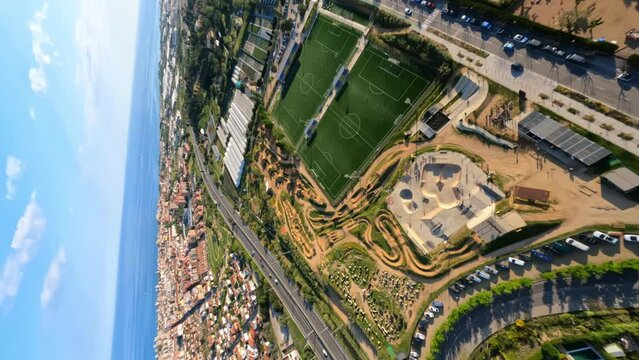 Dynamic vertical fpv view around Lapoma bike park in Premia de Dalt, Spain