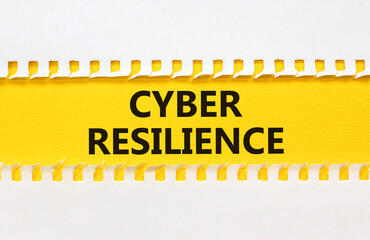 Obraz premium Cyber resilience symbol. Concept word Cyber resilience typed on yellow and white paper. Beautiful yellow and white background. Business and cyber resilience concept. Copy space.