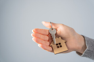 Woman holding house keys in her hand