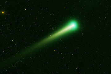 Green comet in dark space. Elements of this image furnished by NASA