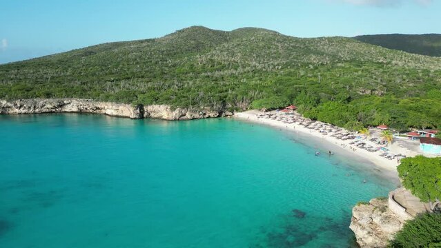 Aerial drone footage over Grote Knip in West Punt Curaca. Carribean beach drop down footage over the clear sea and sand