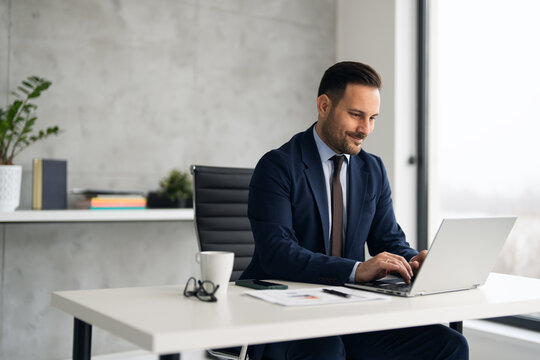 Handsome Well Dressed Businessman Working At His Office, Businessman Working On A Project