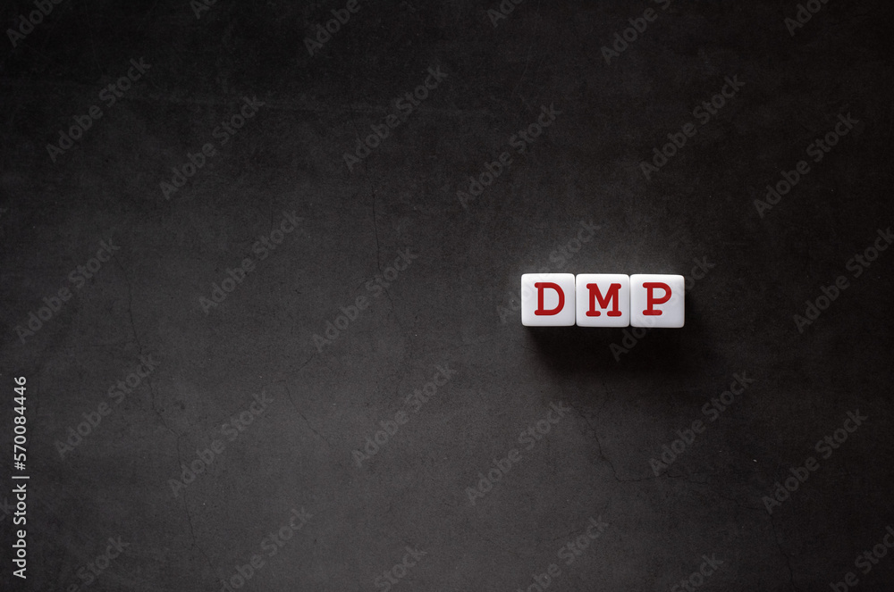 Poster there is white cube with the word dmp. it is an abbreviation for data management platform as eye-cat