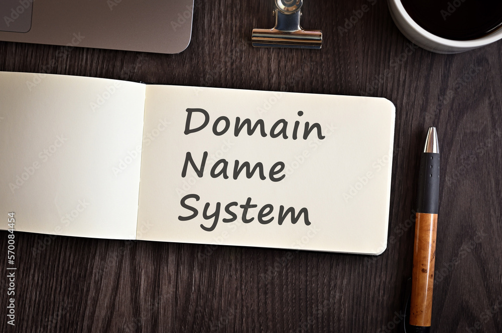 Poster there is notebook with the word domain name system. it is an eye-catching image.