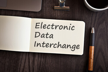 There is notebook with the word Electronic Data Interchange. It is an eye-catching image.