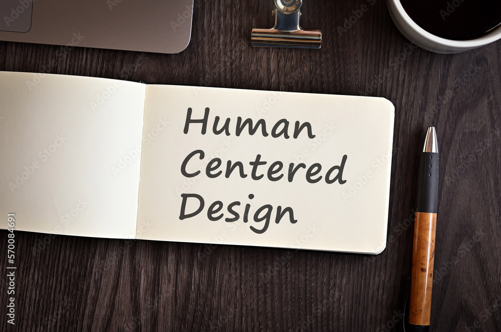 Poster there is notebook with the word human centered design. it is an eye-catching image.