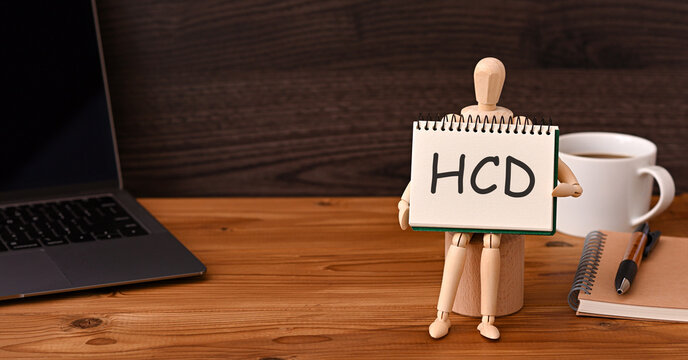 There is sketchbook with the word HCD. It is an abbreviation for Human Centered Design as eye-catching image.