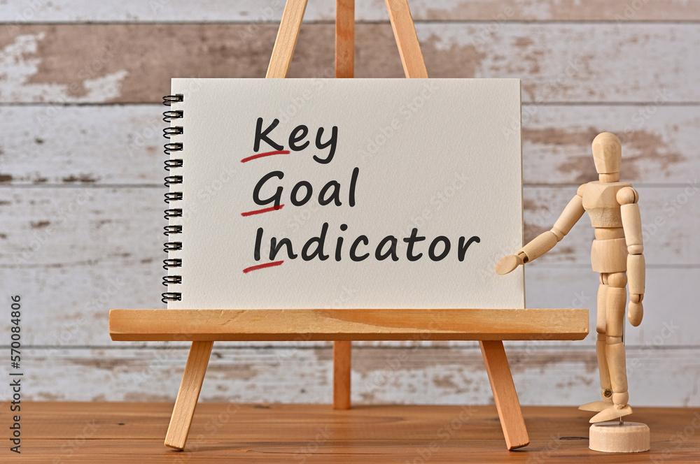 Poster there is notebook with the word key goal indicator. it is an eye-catching image.