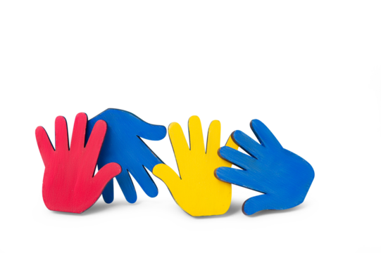 Colorfull puzzles hands on blue background. World Autism Awareness Day Concept
