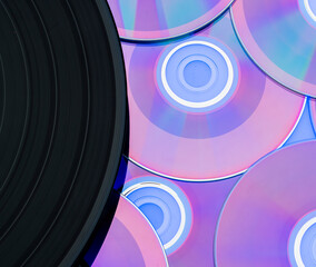 beautiful background with a vinyl record and CDs. music entertainment technology concept