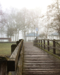 Obraz na płótnie Canvas Bridge to the park in fog