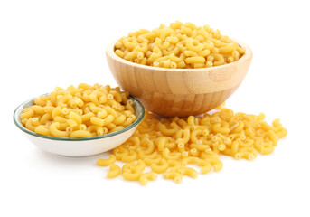 Bowls of uncooked elbow pasta isolated on white background