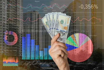 Stock exchange. Man holding dollar banknotes, closeup. Double exposure of digital graphs with statistic information and buildings