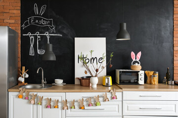 Interior of kitchen with Easter decor and white counters