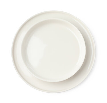Beautiful empty ceramic plates on white background, top view