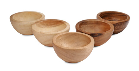Set of wooden bowls on white background