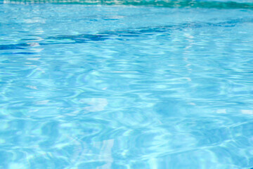 Outdoor swimming pool with clear rippled water