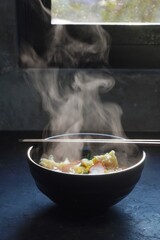 egg noodles with pork wonton soup or pork dumplings soup and vegetable - Asian food style.hot food