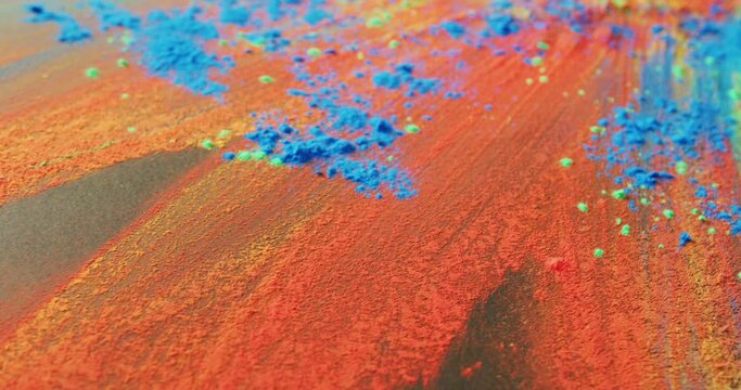 Video of multi coloured powders with copy space on black background