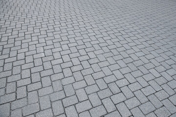 View on grey stone sidewalk. Footpath covering