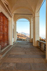 The front colonnade of Madonna del Sasso sanctuary, on the hills surrounding Lake Orta (Piedmont Northern Italy), is an ancient Christian church, built in the 18th century, in honor of the Holy Mary.