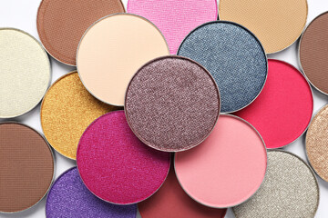 Beautiful eye shadow refill pans on white background, flat lay