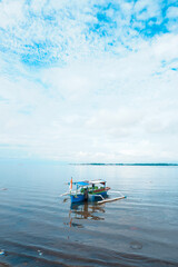 Old fisherman preparing his fishing net and rowing fishing boat before going in to ocean, Fisherman...